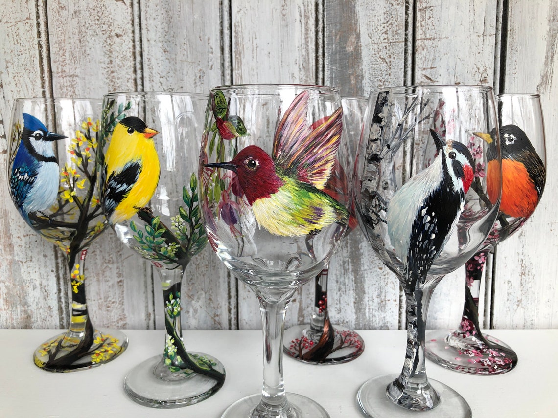 Hand painted bird on wine glass