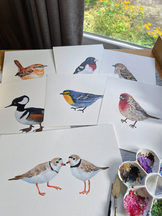 Hand-painted bird collection in Tiffany's studio