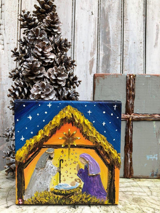 Original nativity painting on canvas with baby Jesus in the manger
