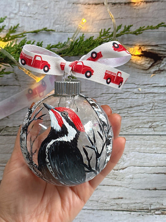 Pileated woodpecker hand painted on a glass Christmas ornament